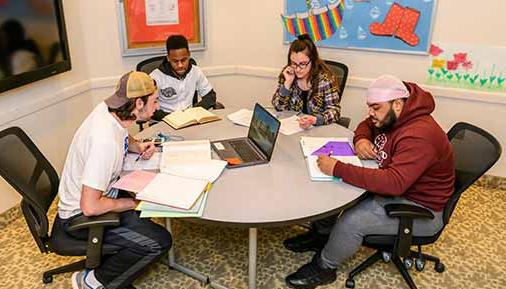 Students studying at a table